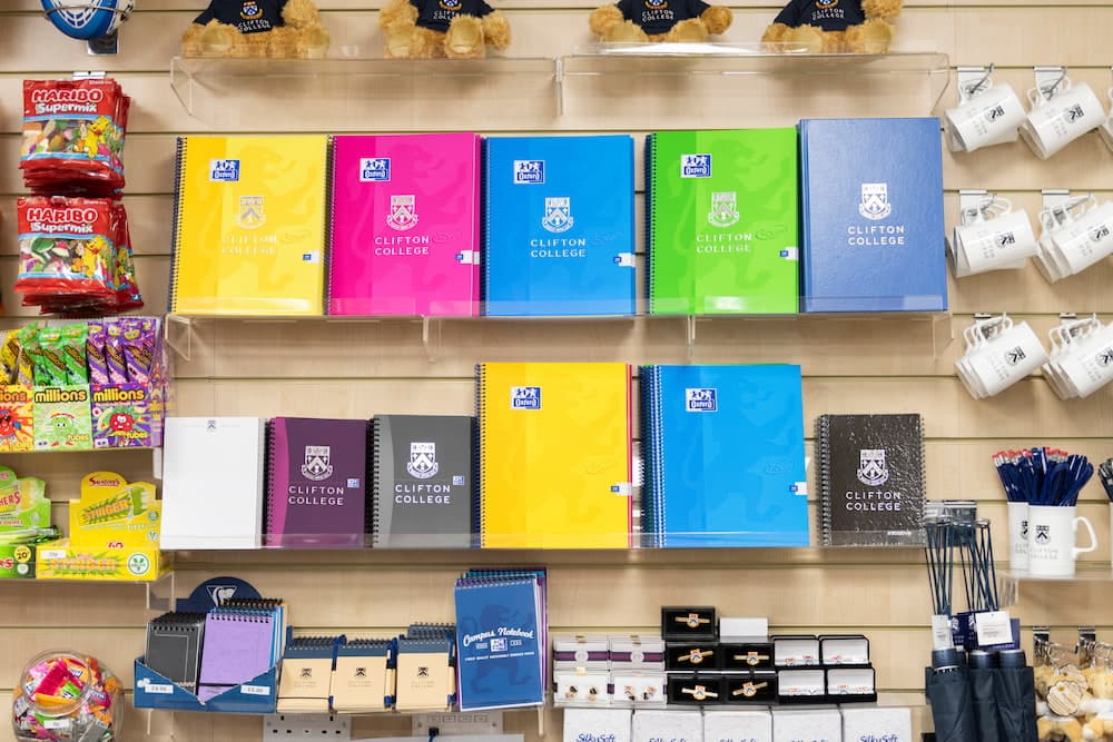 Row of colourful books on a shelf in the school shop